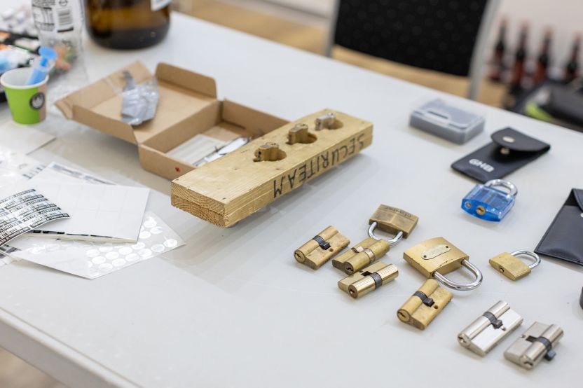 MetaDefender Sandbox Team presents groundbreaking research with locks, lockpicking tools, and security items on table