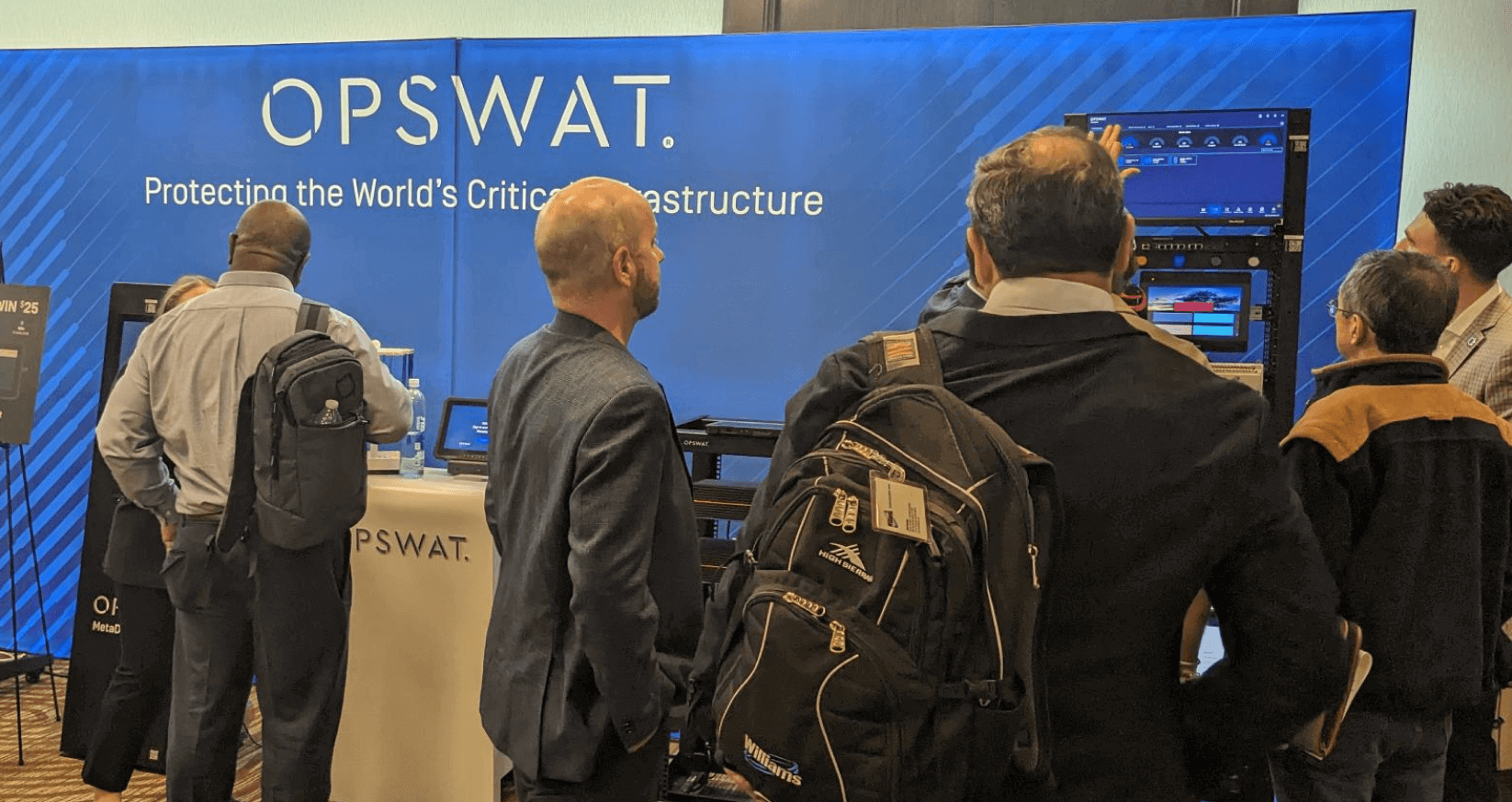people at opswat's cs4ca conference booth