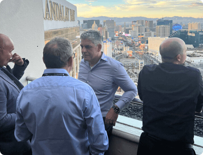 opswat's ceo and founder, benny czarny, talking to guests on a mandalay bay balcony overlooking las vegas