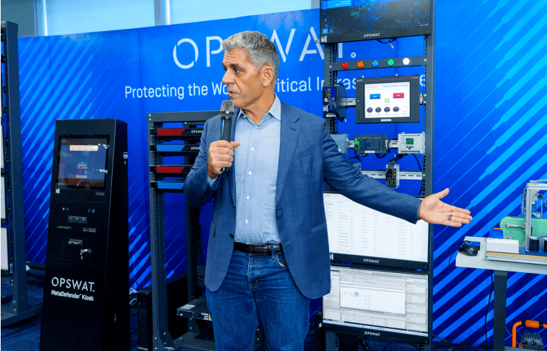 CEO and Founder, Benny Czarny presenting in front of OPSWAT cybersecurity solutions