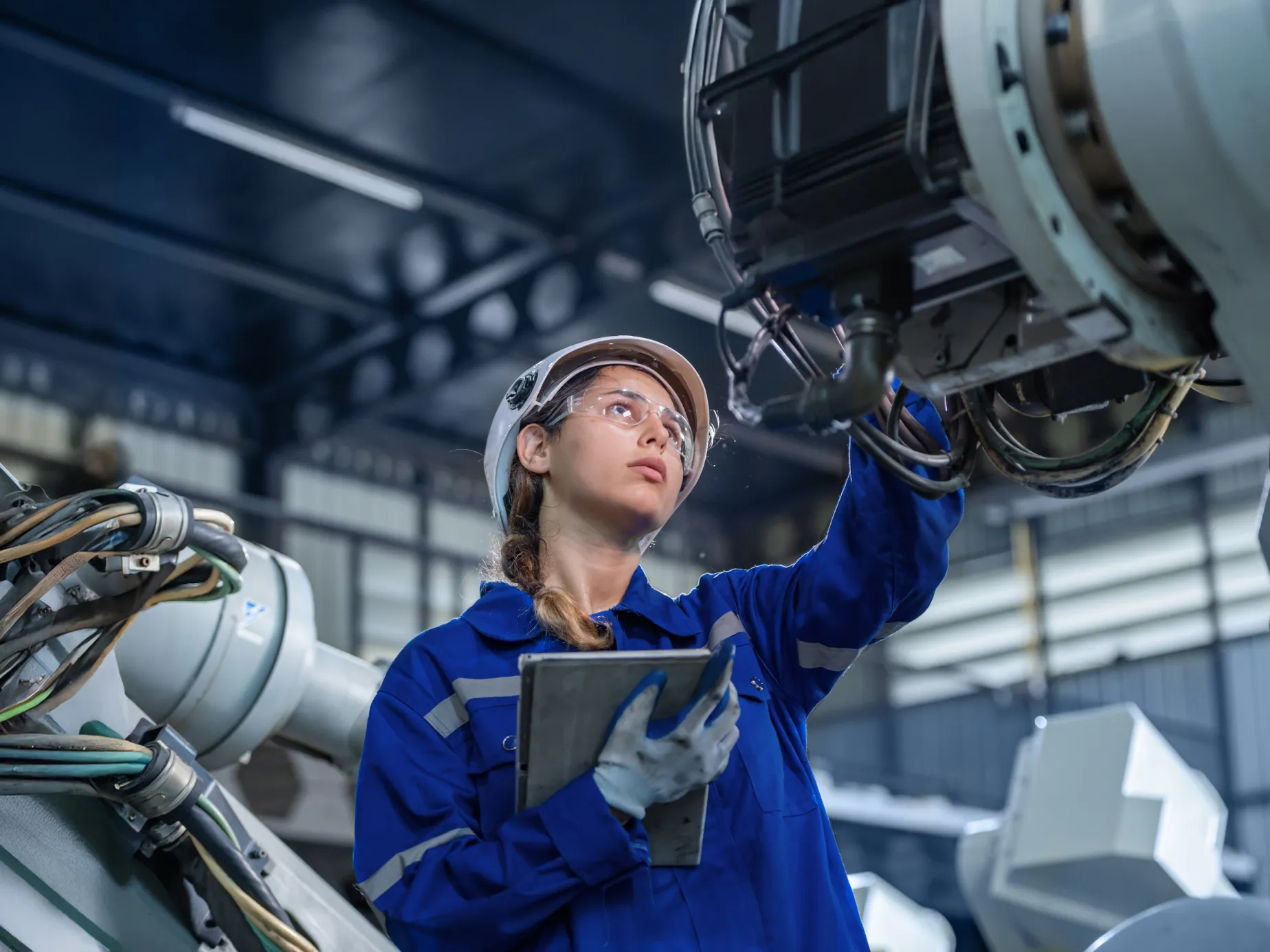 Engineer inspects industrial equipment with tablet, illustrating data diodes buyer's guide checklist context